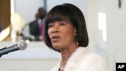 Jamaican Prime Minister Portia Simpson Miller speaks during her swearing-in ceremony at King's House in Kingston January 5, 2012.