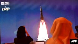 A picture taken July 19, 2020, shows a screen broadcasting the launch of the "Hope" Mars probe at the Mohammed Bin Rashid Space Centre in Dubai, United Arab Emirates.