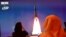 A picture taken July 19, 2020, shows a screen broadcasting the launch of the "Hope" Mars probe at the Mohammed Bin Rashid Space Centre in Dubai, United Arab Emirates.