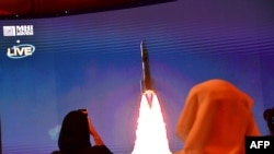 A picture taken July 19, 2020, shows a screen broadcasting the launch of the "Hope" Mars probe at the Mohammed Bin Rashid Space Centre in Dubai, United Arab Emirates.