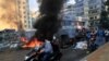 Saad Hariri's supporters block streets in Beirut, Lebanon, Thursday, July 15, 2021.