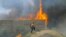 A brush fire burns at a shooting range on the beach at Navel Base Ventura County May 3, 2013