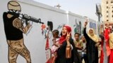 Female Sudanese demonstraters celebrate in Khartoum Aug. 4, 2019, after Sudan's army rulers and protest leaders signed a hard-won power-sharing agreement. 