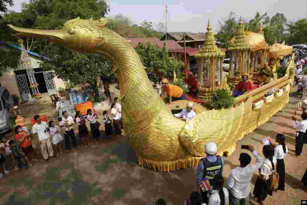 A chariot carrying a golden urn makes its way during a procession in Oudong, Kandal province, northwest of Phnom Penh, Cambodia.