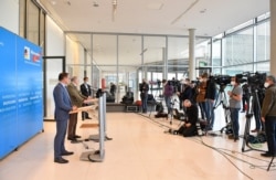 The co-leader of the Alternative for Germany far-right party Alexander Gauland and the vice-leader of the parliamentary group Tino Chrupalla, left, address a press conference, in the parliamentary compound of the Bundestag in Berlin, March 3, 2021.