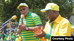 Nape Nnauye, spokesman for the ruling Chama Cha Mapinduzi party, speaks alongside President-elect John Magufuli. (Credit: Nape Nnauye)