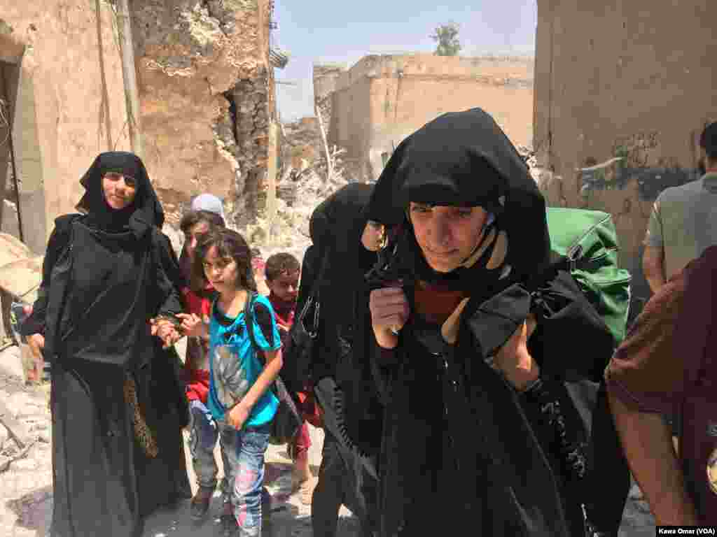 Women and children were among the many Iraqi civilians to flee fighting against Islamic State militants in the Old City of Mosul, Iraq, July 1, 2017.