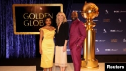 Golden Globes President Helen Hoenhe and actors Mindy Kaling and Morris Chestnut pose during nominations announcement for the 82nd Golden Globe Awards in Beverly Hills, California, Dec. 9, 2024. 