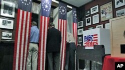 Residents mark their ballots before the stroke of midnight when they can cast their voters in the first-in-the-nation presidential primary, at The Balsams Grand Resort, in Dixville, New Hampshire, January 9, 2012.