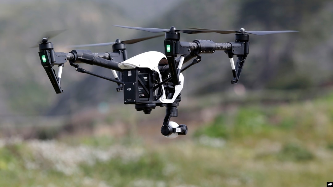 FILE - The Inspire 1, a drone manufactured by DJI, is flown in Davenport, Calif., March 10, 2015. 