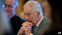 FILE - Britain's King Charles III hosts a gathering of young UK community and faith leaders to discuss the challenges their communities face, at Buckingham Palace, in London, Dec. 13, 2023. 