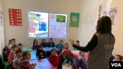 Syrian children are seen in a classroom in Himaya Center, a nongovernmental organization based in Lebanon that works to protect and educate children, mainly girls, and their families of the risks of child marriage. (N. Ahmado/VOA)