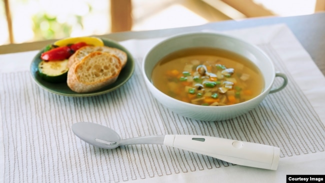 The device spoon designed to enhance the taste of salt in food is shown in this image provided by its developer, Japan's Kirin Holdings. (Kirin Holdings/Business Wire)