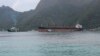 The North Korean cargo ship, Wise Honest, middle, was towed into the Port of Pago Pago, May 11, 2019, in Pago Pago, American Samoa.