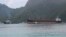 The North Korean cargo ship, Wise Honest, right, was towed into the Port of Pago Pago, May 11, 2019, in Pago Pago, American Samoa.