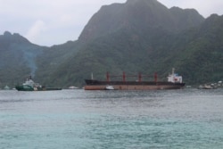 FILE - The North Korean cargo ship, Wise Honest, middle, was towed into the Port of Pago Pago, May 11, 2019, in Pago Pago, American Samoa.