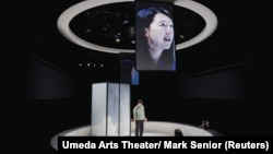 Actors Susan Momoko Hingley and Mark Takeshi Ota perform in the production of "One Small Step" in London, Britain, September 27, 2024. (Umeda Arts Theater/ Mark Senior/Handout via REUTERS)