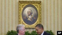 President Barack Obama meets with Italian Prime Minister Mario Monti in the Oval Office of the White House in Washington, February 9, 2012.