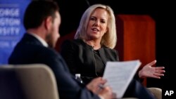 Homeland Security Secretary Kirstjen Nielsen, joined by director of Auburn University's McCrary Institute for Cyber and Critical Infrastructure Security, Frank Cilluffo, speaks at George Washington University's Jack Morton Auditorium in Washington, March 18, 2019. 