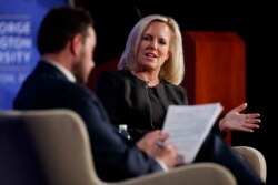 FILE - Former Homeland Security Secretary Kirstjen Nielsen, joined by director of Auburn University's McCrary Institute for Cyber and Critical Infrastructure Security, Frank Cilluffo, speaks at George Washington University in Washington, May 6, 2019.