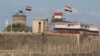 FILE - An Egyptian soldier stands guard on the border between Egypt and southern Gaza Strip, Sept. 8, 2013. 