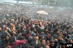 Kashmiri villagers carry a body of top militant commander Zakir Musa of Ansar Ghazwat-ul-Hind group during a funeral procession at Dadsar village in Tral, south of Srinagar, May 24, 2019.