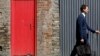 Red Doors Mark Asylum Seekers' Houses in British Town 