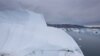 FILE - In this July 19, 2007 file photo, an iceberg is seen melting off the coast of Ammasalik, Greenland. A new assessment of climate change in the Arctic shows the ice in the region is melting faster than previously thought and sharply raises projectio