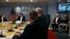 FILE - President Donald Trump, at head of table, listens to briefing about Hurricane Dorian at the Federal Emergency Management Agency in Washington, Sept. 1, 2019.