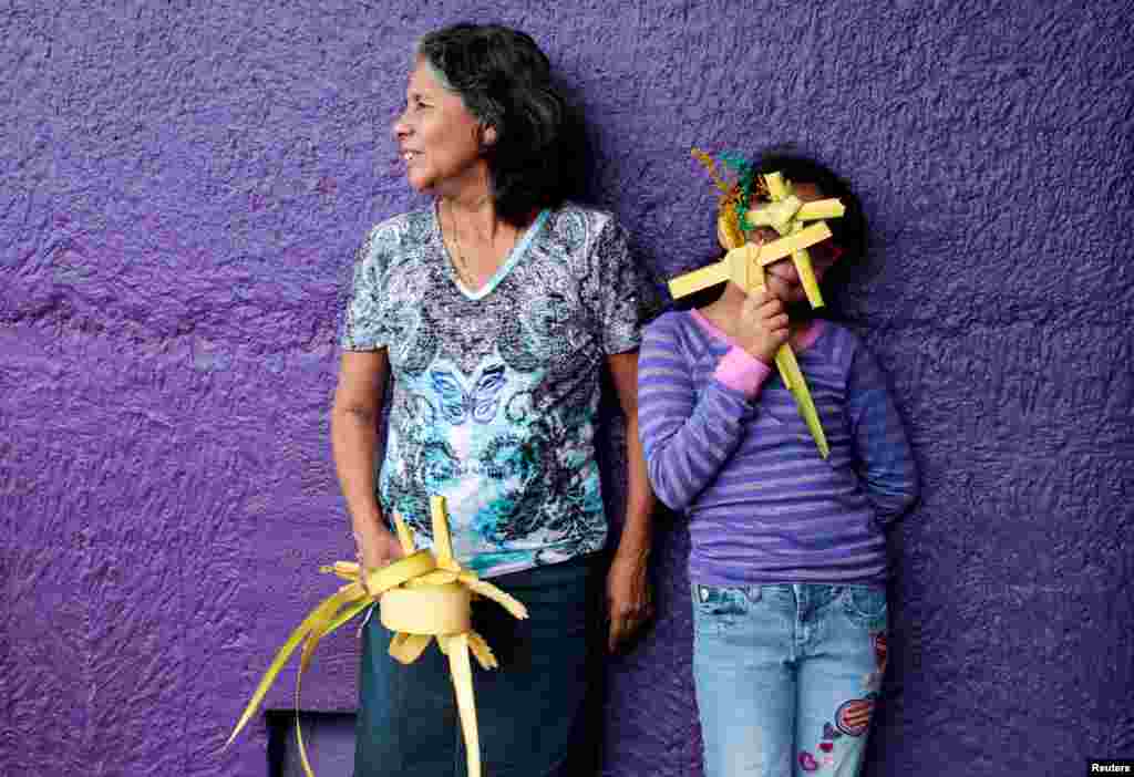 Catholics attend a Palm Sunday procession at the Metropolitan Cathedral in Managua, Nicaragua.