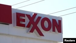 FILE - The Exxon Mobil logo is shown at a gas station in Denver, Colorado, US.