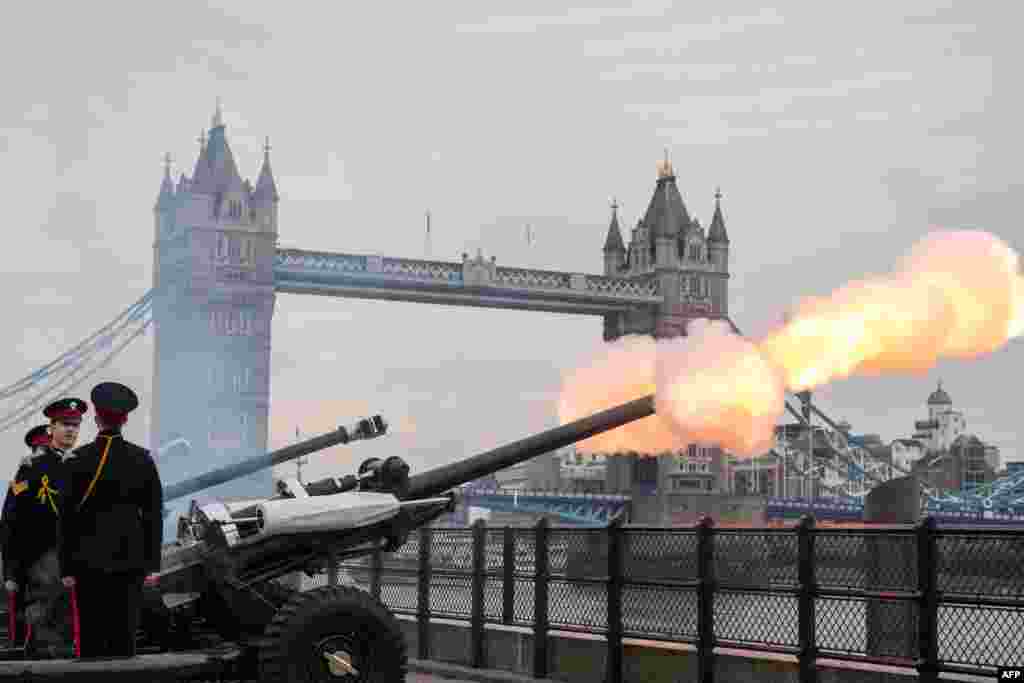 Members of the Honourable Artillery Company fire a 62 round royal gun salute from the Gun Wharf outside the Tower of London to mark the anniversary of Queen Elizabeth II&#39;s accession to the throne in London.