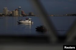 FILE - Security is seen outside Mar-a-Lago in Palm Beach, Fla., Feb. 2, 2019.