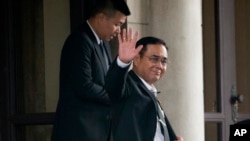Thailand's Prime Minister Prayuth Chan-ocha waves to the media as he leaves the government house in Bangkok, Thailand, June 5, 2019.