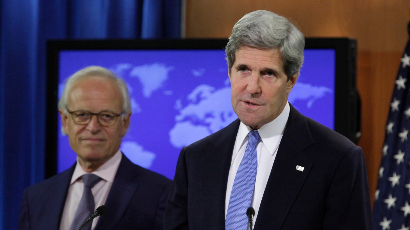 U.S. Secretary of State John Kerry (R) speaks next to Martin Indyk at the State Department in Washington, July 29, 2013.