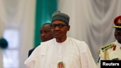 FILE - Nigeria's President Muhammadu Buhari attends the opening of the 56th Ordinary Session of the ECOWAS Authority of Heads of State and Government in Abuja, Dec. 21, 2019. Buhari holds, Oct. 31, 2022, emergency meetings with security chiefs amid terror warnings.