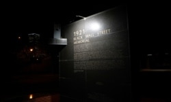 FILE - A monument to the 1921 Black Wall Street massacre is pictured in Tulsa, Oklahoma, June 18, 2020.