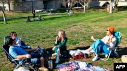 LOS ANGELES, CA - NOVEMBER 26: People gather at a picnic lunch in Pan Pacific Park during Thanksgiving on November 26, 2020 in Los Angeles, California. Americans celebrate the Thanksgiving holiday as coronavirus cases continue to surge across the…