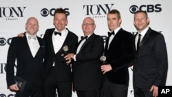 Simon Stephens, second right, Michael Morris, second left, and the crew accept the award for best play for "The Curious Incident of the Dog in the Night-Time" at the 69th annual Tony Awards at Radio City Music Hall on Sunday, June 7, 2015, in New York.