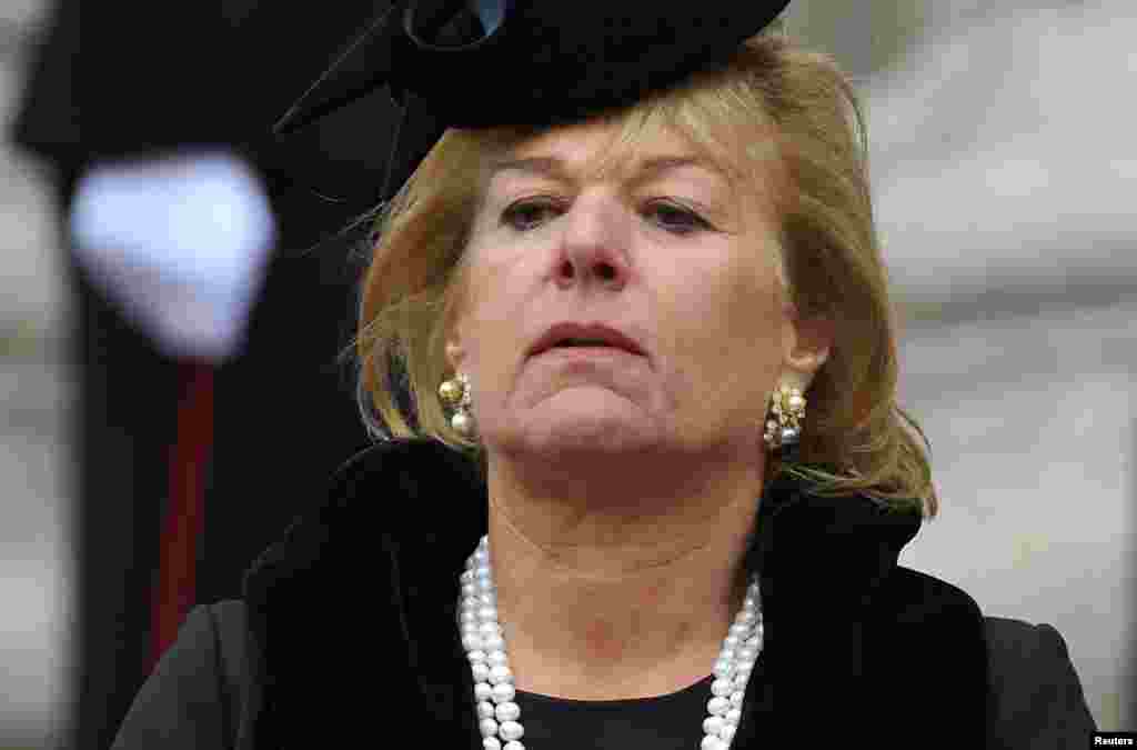 Carol Thatcher watches as the hearse carrying her mother, former British prime minister, Margaret Thatcher, is driven away after her funeral service at St Paul&#39;s Cathedral.