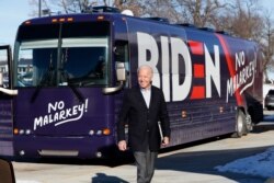 Democratic presidential candidate former Vice President Joe Biden arrives at a stop on his bus tour, Dec. 2, 2019, in Emmetsburg, Iowa.
