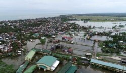 Floodwaters caused by typhoon Vongfong inundate a village as it passed by Sorsogon province, eastern Philippines on May 15, 2020.