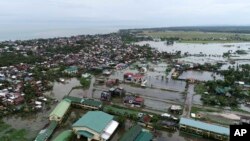 Floodwaters caused by typhoon Vongfong inundate a village as it passed by Sorsogon province, eastern Philippines, May 15, 2020. 