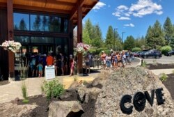 Guests at Sunriver resort near Bend, Oregon line up to get into the pool on June 29, 2021 as temperatures were predicted to hit 106 degrees Fahrenheit.