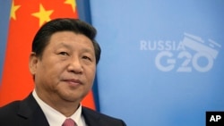 China's President Xi Jinping, prior to a meeting with Russia's President Vladimir Putin at the G-20 summit in St. Petersburg, Russia, Sept. 5, 2013. 