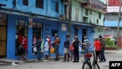 People line up at a bakery in Havana ahead of the arrival of Hurricane Rafael on Nov. 6, 2024.