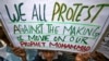 A Muslim youth holds up a placard during a protest against against the anti-Islam film, in Jammu, India Sept. 21, 2012.