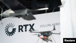 Signage for RTX is seen during an exposition in Washington on Oct. 14, 2024. Federal prosecutors said on Oct. 16 that RTX agreed to pay $252 million to resolve charges alleging that it paid bribes to secure contracts with the Qatar military.