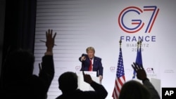 FILE - President Donald Trump takes questions during a press conference at the G-7 summit in Biarritz, France, Aug. 26, 2019. 