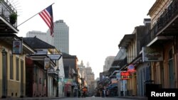 FILE - An empty Bourbon Street is seen amid the outbreak of the coronavirus disease, in New Orleans, Louisiana, March 25, 2020. 
